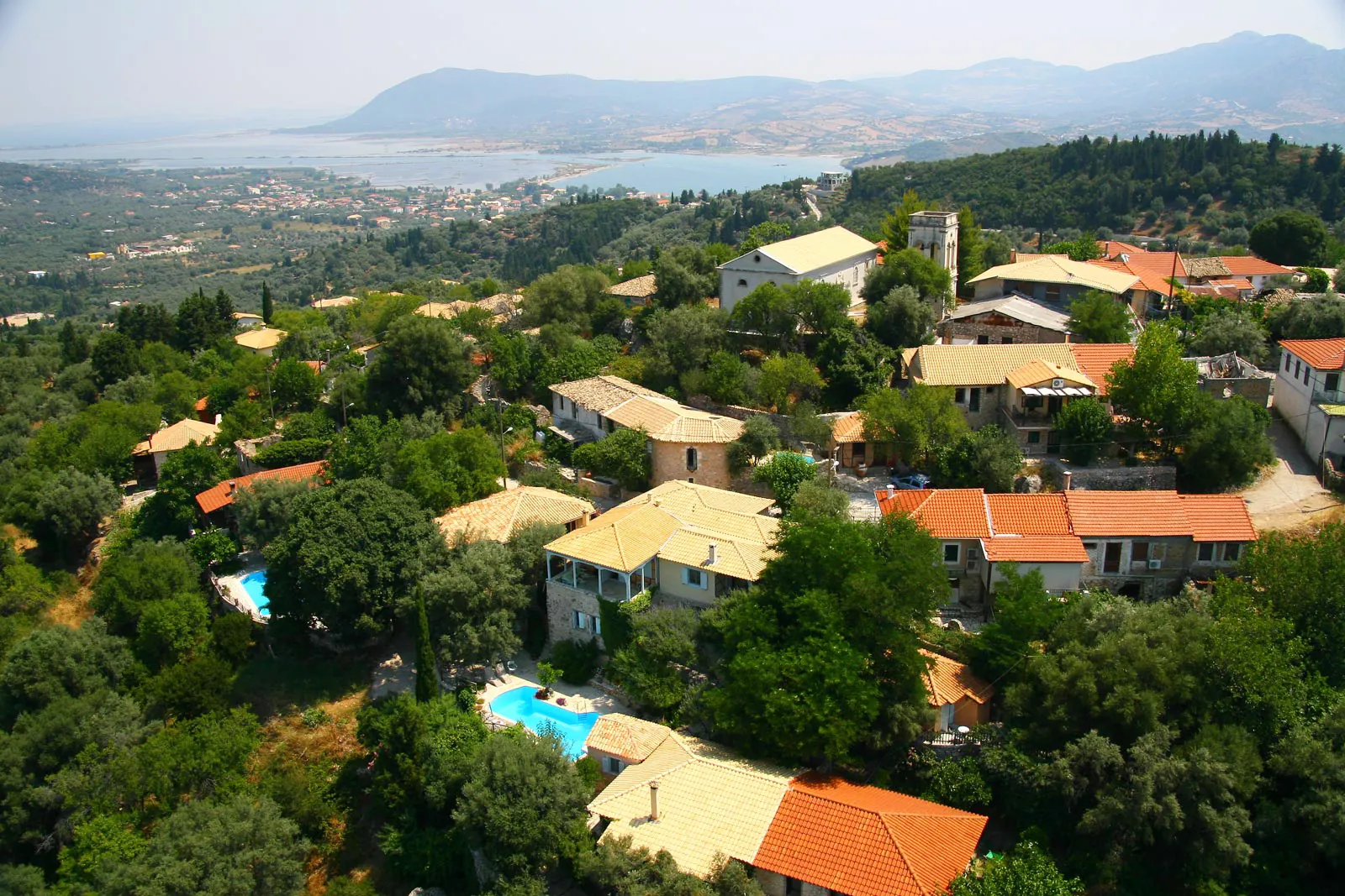 Aerial view of Katouna village surrounded by green hills